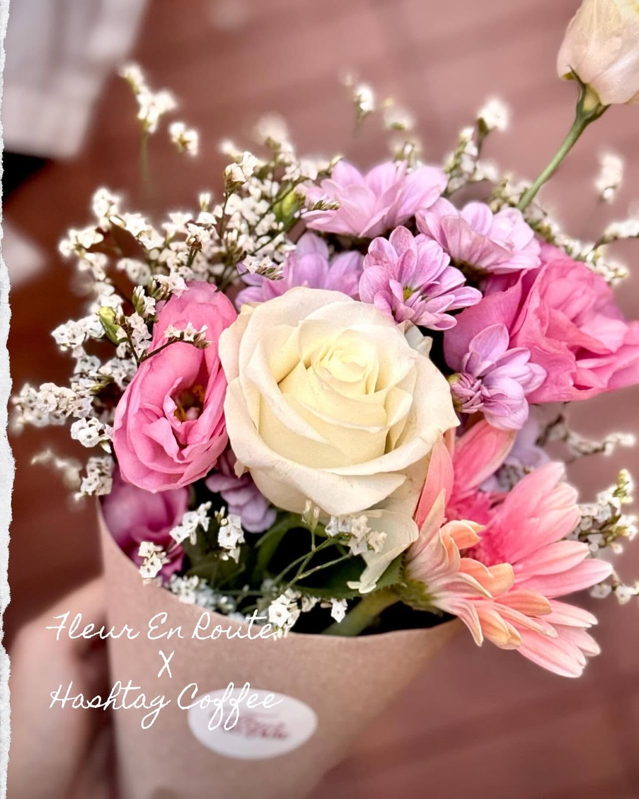 Pastel bouquet of roses and daisies wrapped in kraft, a collab with Hashtag Coffee