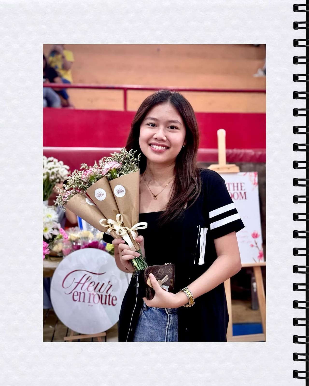 A customer holding three kraft cone bouquets tied with ribbon